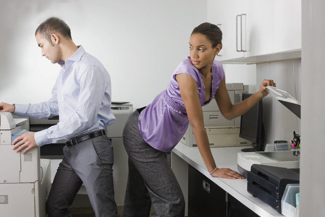 Businesswoman Attracted to Businessman --- Image by © Sean De Burca/Corbis